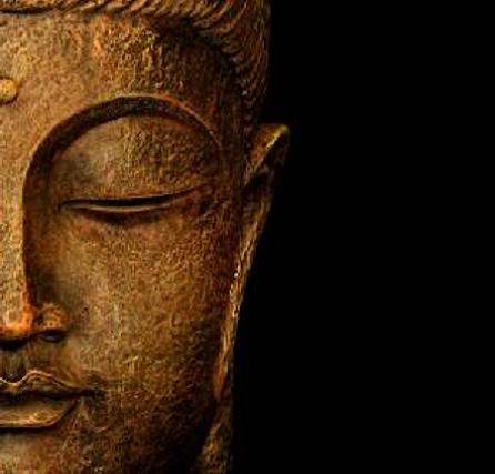 Statue representing the portrait of Buddha in meditation. Copy space.
